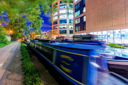 LONDON, UNITED KINGDOM - SEPTEMBER 23: Boats along the Regenets canal with modern office buildings in the background on September 23, 2017 in Londonのeditorial素材