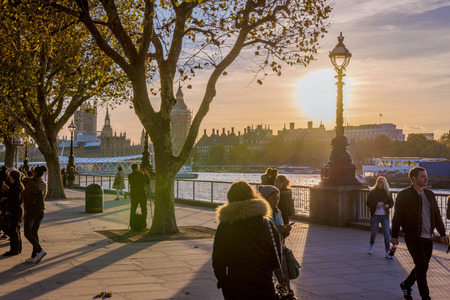 LONDON, UNITED KINGDOM - NOVEMBER 07: Thames riverside walking path in Central London during sunset...