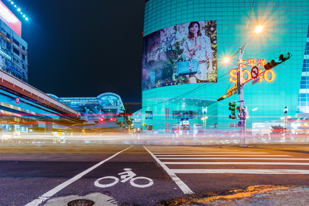 TAIPEI, TAIWAN - MARCH 12: Night view of Zhongxiao fuxing downtown area with the Sogo department store building  on March 12, 2017 in Taipeiのeditorial素材