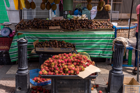 KUALA LUMPUR, MALAYSIA - JULY 22: Fruit stall selling local fruits on a city street near Chow Kit Market on July 22, 2018 in Kuala Lumpurのeditorial素材
