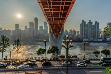 CHONGQING, CHINA - SEPTEMBER 21: City view of Dongshuimen bridge a famous landmark along the Yangtze river during sunset on September 21, 2018 in Chongqingのeditorial素材