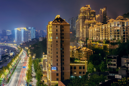 CHONGQING, CHINA - SEPTEMBER 22: View of luxury high rise apartment buildings at night on Nanbin Road on September 22, 2018 in Chongqingのeditorial素材