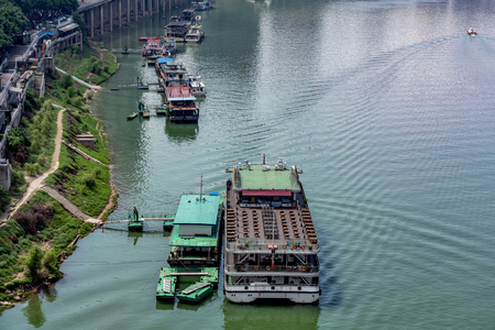 CHONGQING, CHINA - SEPTEMBER 21: Aerial view of boats docked along the river banks of the Jialing river on September 21, 2018 in Chongqingのeditorial素材