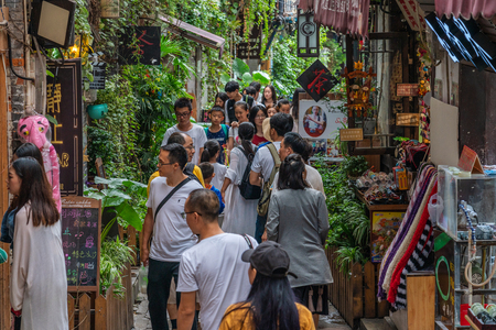 CHONGQING, CHINA - SEPTEMBER 20: View of an alley with shops and stalls in Ciqikou ancient town, a popular travel destination on September 20, 2018 in Chongqingのeditorial素材