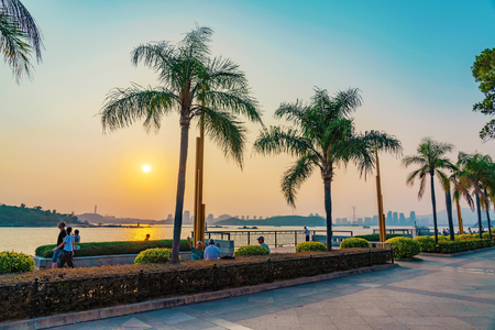 XIAMEN, CHINA -OCTOBER 08: View of the sunset and ocean at the waterfront promenade area on October 08, 2018 in Xiamenのeditorial素材