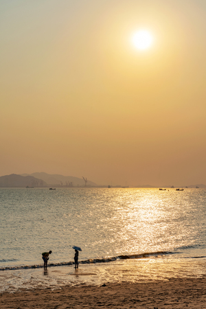 Baicheng beach at sunset in Xiamenの写真素材