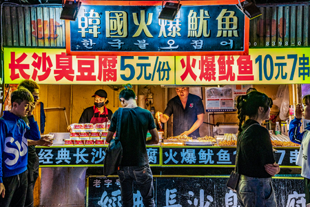 GUANGZHOU, CHINA - OCTOBER 22: Night market street food stalls at Sanxiajiu Pedestrian street in the downtown area on October 22, 2018 in Guangzhouのeditorial素材