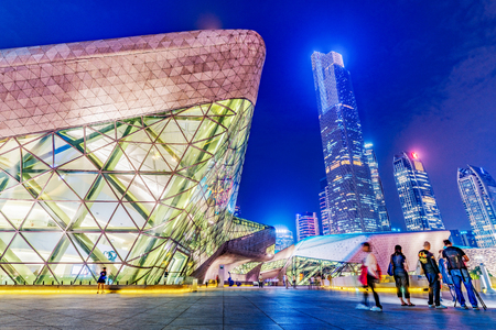 GUANGZHOU, CHINA - OCTOBER 23: Modern architecture of the Guangzhou Opera House and downtown city buildings at night on October 23, 2018 in Guangzhouのeditorial素材