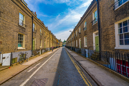 CAMBRIDGE, UNITED KINGDOM - APRIL 18: View of a residential street with traditional British houses...