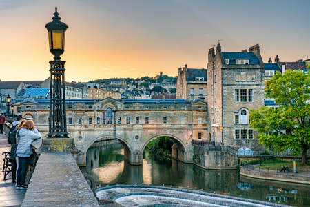 BATH, UNITED KINGDOM, JULY 02: View of Pulteney Bridge, a famous landmark along the River Avon during sunset on July 02, 2019 in Bathのeditorial素材