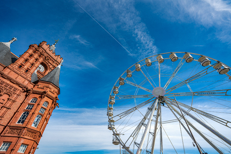 CARDIFF, UNITED KINGDOM - JULY 04:  The famous Pierhead Building and ferris wheel at Cardiff Bay on July 04, 2019 in Cardiffのeditorial素材