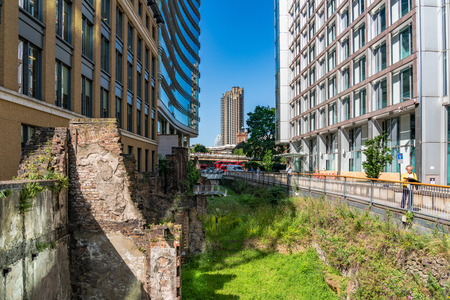 LONDON, UNITED KINGDOM - JUNE 27: View of high rise buildings with ruins of the historic London Wall below on June 27, 2019 in Londonのeditorial素材