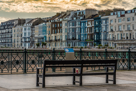 HASTINGS, UNITED KINGDOM - JULY 29: View of Hastings waterfront buildings and pier during sunset on July 29, 2019 in Hastingsのeditorial素材
