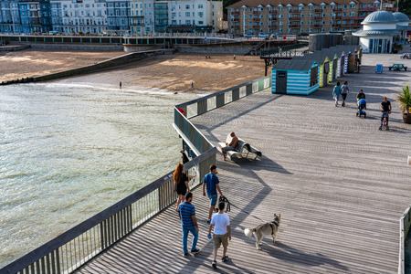 HASTINGS, UNITED KINGDOM - JULY 29: Hastings pier along the seaside area, a popular tourist destination in the summer time on July 29, 2019 in Hastingsのeditorial素材