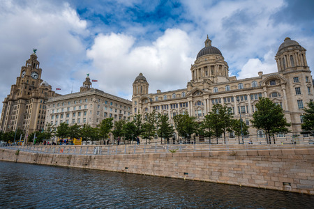LIVERPOOL, UNITED KINGDOM - AUGUST 11: The Pier Head, Cunard and liver buildings area famous landmark buildings along the waterfront area on August 11, 2019 in Liverpoolのeditorial素材