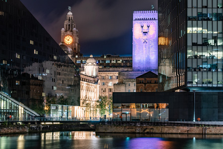 LIVERPOOL, UNITED KINGDOM - AUGUST 11: This is a night view of city buildings along the waterfront taken from the famous Royal Albert Dock on August 11, 2019 in Liverpoolのeditorial素材