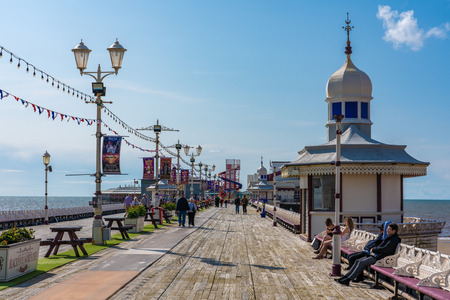 BLACKPOOL, UNITED KINGDOM - AUGUST 12: View of the Blackpool North Pier, a popular tourist destination along the seafront on a sunny day on August 12, 2019 in Blackpoolのeditorial素材