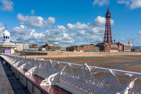 BLACKPOOL, UNITED KINGDOM - AUGUST 12: North Pier benches with Blackpool beach and Tower in the background on a sunny day on August 12, 2019 in Blackpoolのeditorial素材