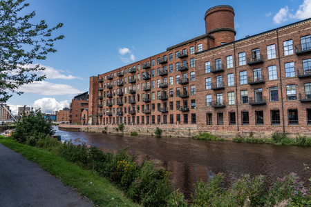 LEEDS, UNITED KINGDOM - AUGUST 13: This is a view of riverside area and apartment buildings on August 13, 2019 in Leedsのeditorial素材