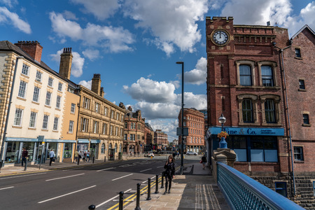 LEEDS, UNITED KINGDOM - AUGUST 13: View of city buildings and high street from Leeds Bridge, an historic bridge in the city centre on August 13, 2019 in Leedsのeditorial素材