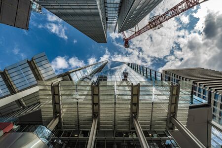 LONDON, UNITED KINGDOM - AUGUST 22: This is a low angle view of The Shard skyscraper building and other modern city building in the downtown area  on August 22, 2019 in Londonのeditorial素材