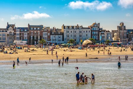 WEYMOUTH, UNITED KINGDOM - AUGUST 30: View of Weymouth beach and waterfront buildings, a popular tourist destination in the summer time on August 30, 2019 in Weymouthのeditorial素材