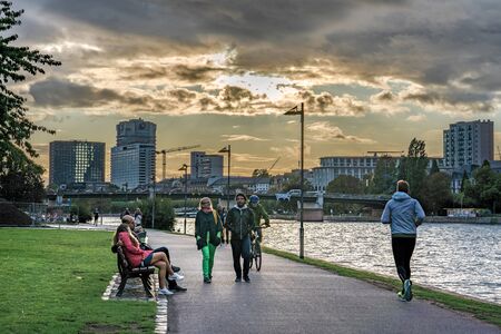 FRANKFURT, GERMANY - SEPTEMBER 25: This is a view of a riverside park in the city center area during sunset on September 25, 2019 in Frankfurtのeditorial素材