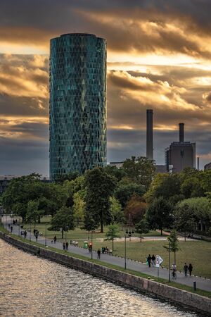 FRANKFURT, GERMANY - SEPTEMBER 25: This is view of the Westhafen Tower building during sunset along the river main on September 25, 2019 in Frankfurtのeditorial素材