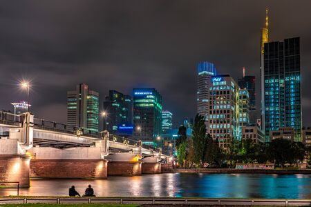 FRANKFURT, GERMANY - SEPTEMBER 25: This is a night view of the financial district city skyline along the river main on September 25, 2019 in Frankfurtのeditorial素材