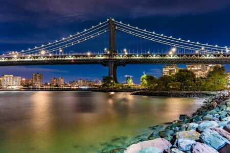 Night view of the Manhattan Bridge along the East River in New York