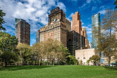 NEW YORK, USA - OCTOBER 10: View of city buildings in the Manhattan financial district from Battery Park, a popular riverside park on October 10, 2019 in New Yorkのeditorial素材