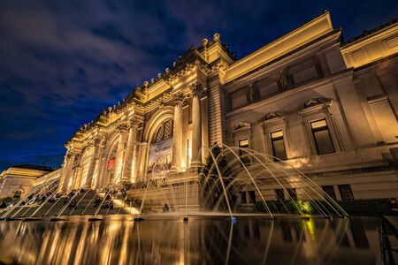 NEW YORK, USA - OCTOBER 12: Night view of the Museum of Modern Art, a popular travel destination on 5th Avenue on October 12, 2019 in New Yorkのeditorial素材