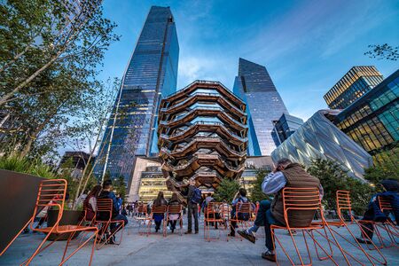 NEW YORK, USA - OCTOBER 13: Evening view of The Vessel modern structure and high rise buildings at Hudson Yards on October 13, 2019 in New Yorkのeditorial素材
