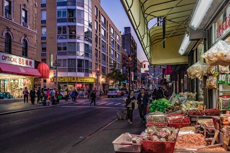 NEW YORK, USA - OCTOBER 14: Evening view of shops on a street in the Chinatown area on October 14, 2019 in New Yorkのeditorial素材