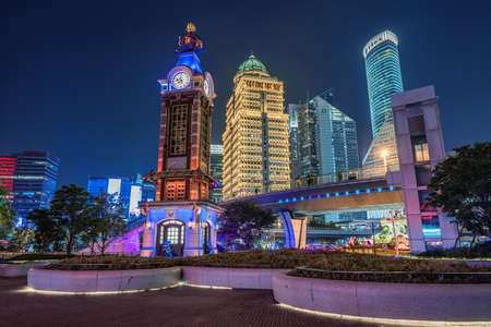 SHANGHAI, CHINA, OCTOBER 30: Night view of the Disney store clock tower in the Lujiazui financial district on October 30, 2019 in Shanghaiのeditorial素材