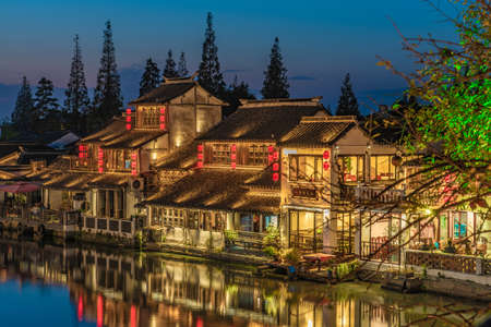SHANGHAI, CHINA, NOVEMBER 01: Evening view of traditional Chinese buildings along the river in Zhujiajiao ancient water town on November 01, 2019 in Shanghaiのeditorial素材