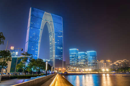 SUZHOU, CHINA- NOVEMBER 04: Night view of the Gate of the East building a famous landmark building on the waterfront of Jinji Lake on November 04, 2019 in Suzhouのeditorial素材