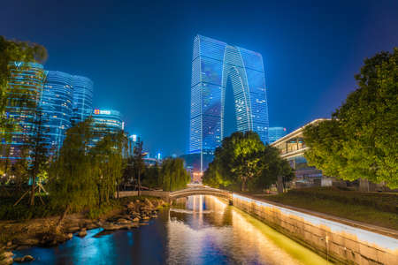 SUZHOU, CHINA- NOVEMBER 04: Night view of the Gate of the East a famous landmark building on the waterfront of Jinji Lake on November 04, 2019 in Suzhouのeditorial素材