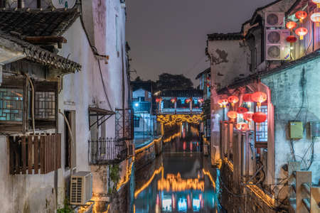 SUZHOU, CHINA- NOVEMBER 04: Traditional Chinese riverside buildings along a canal in Shantang Street at night on November 04, 2019 in Suzhouのeditorial素材