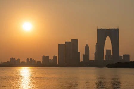 SUZHOU, CHINA- NOVEMBER 05: View of the financial district city skyline from Jinji Lake during sunset on November 05, 2019 in Suzhouのeditorial素材