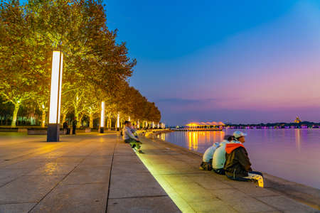 SUZHOU, CHINA- NOVEMBER 05: Evening view of the lakeside park at Jinji Lake, a popular tourist destination on November 05, 2019 in Suzhouのeditorial素材
