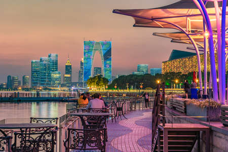 SUZHOU, CHINA- NOVEMBER 05: This is an evening view of a lakeside area at Moon Harbor, a popular...