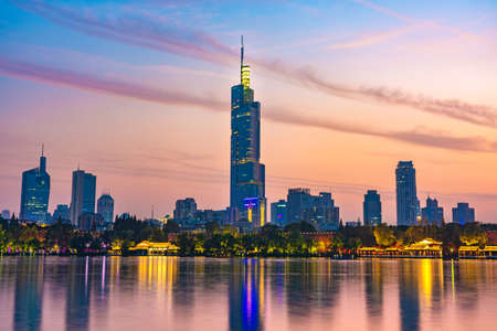 NANJING, CHINA - NOVEMBER 09: This is an evening view of Zifeng Tower and downtown city buildings from Xuanwu Lake on November 09, 2019 in Nanjingのeditorial素材