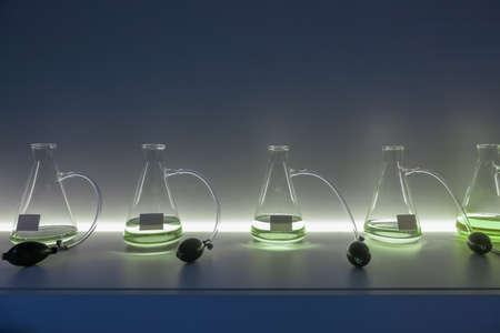 Atomizer spray perfume bottles on a showcase with illumination. Ready for tasting of aromas. Front...