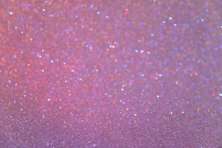 Glitter sparkling pink and purple texture. Beautiful Christmas and new year bokeh background