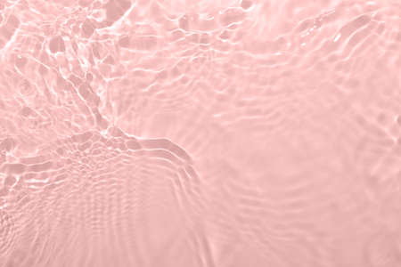 Fresh water background. Light pink pattern with natural rippled water texture. Top view with copy...