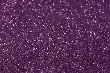 Glitter sparkling purple texture. Beautiful Christmas and new year bokeh blurred backgroundの写真素材