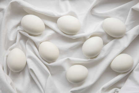 White eggs on a linen cloth.の写真素材