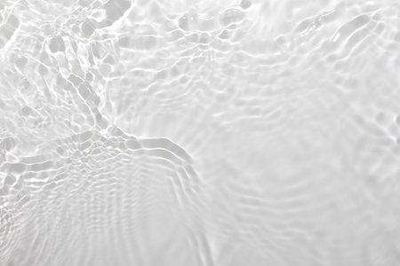 Fresh water background. Neutral white pattern with cleat rippled water texture and splashes. Top view, for color overlayの写真素材