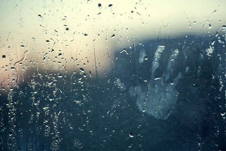 water drops background with chid's hand HDの写真素材